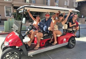 People riding on a Golf Cart